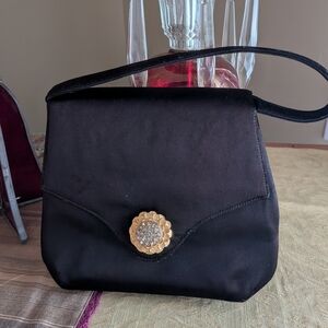 Elegant Black Satin Handbag with Gold Accent